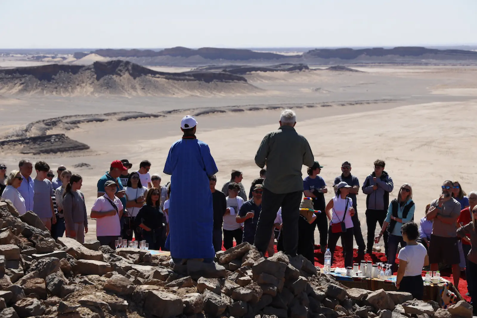 Group of travelers exploring Gara Medouar near Erfoud on a private Morocco tours