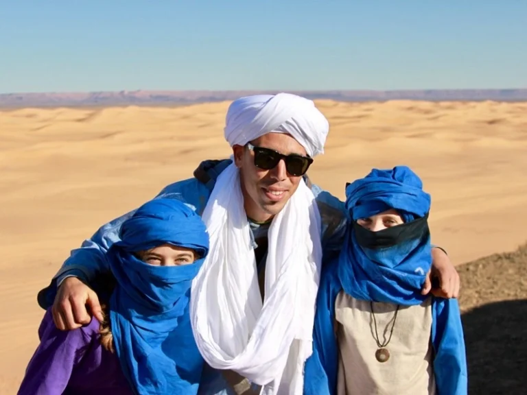 Family enjoying a Merzouga desert trip during a tour from Casablanca
