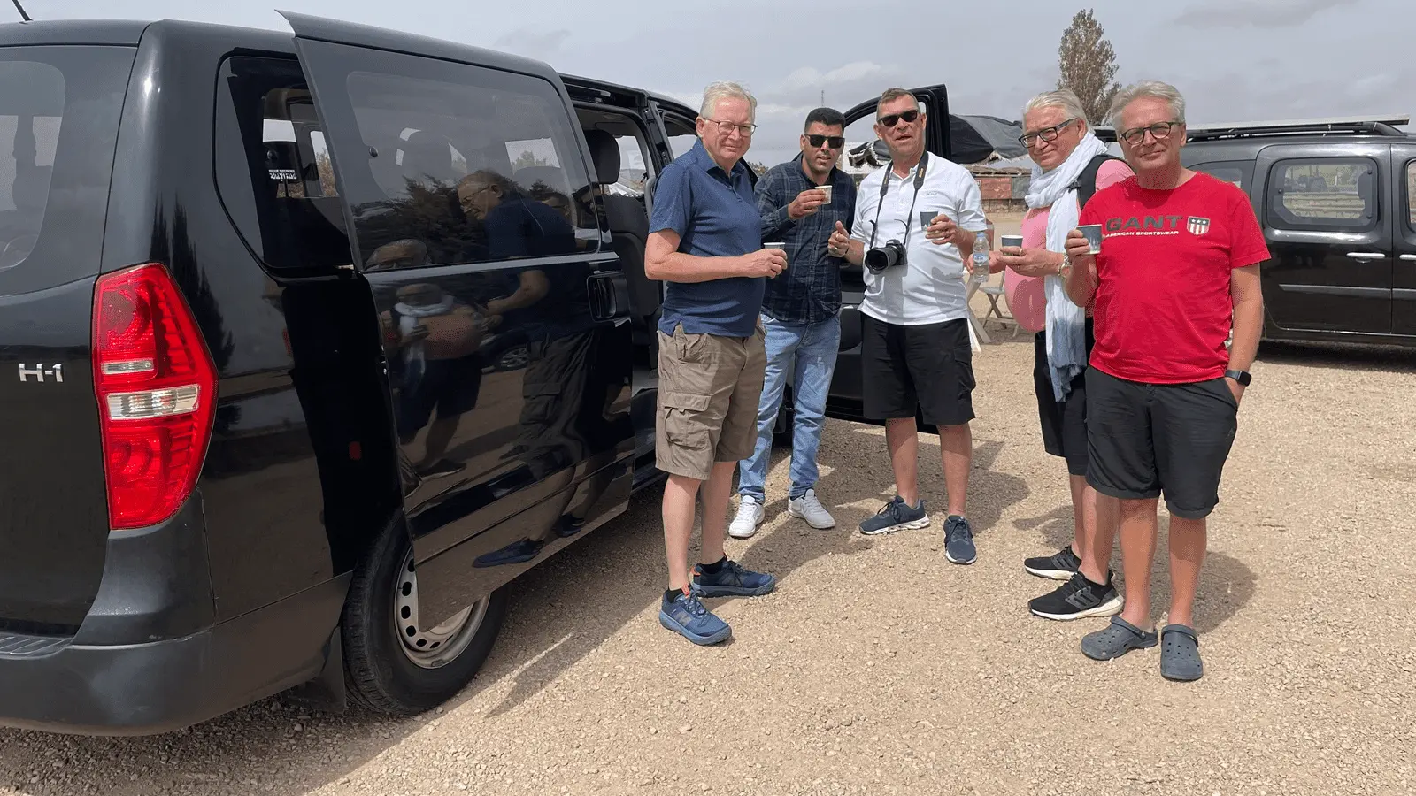 Travelers stopping for coffee in the Middle Atlas Mountains during an 8-Day Tangier to Marrakech Desert Tour
