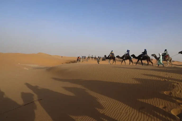 Camel trekking in Erg Chebbi dunes on a 3-day Sahara Desert tour from Fes to Marrakech
