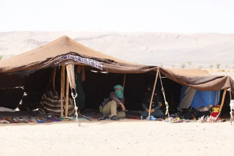 Berber Nomadic family inside a traditional desert tent near Merzouga during a 5-day desert tour from Marrakech