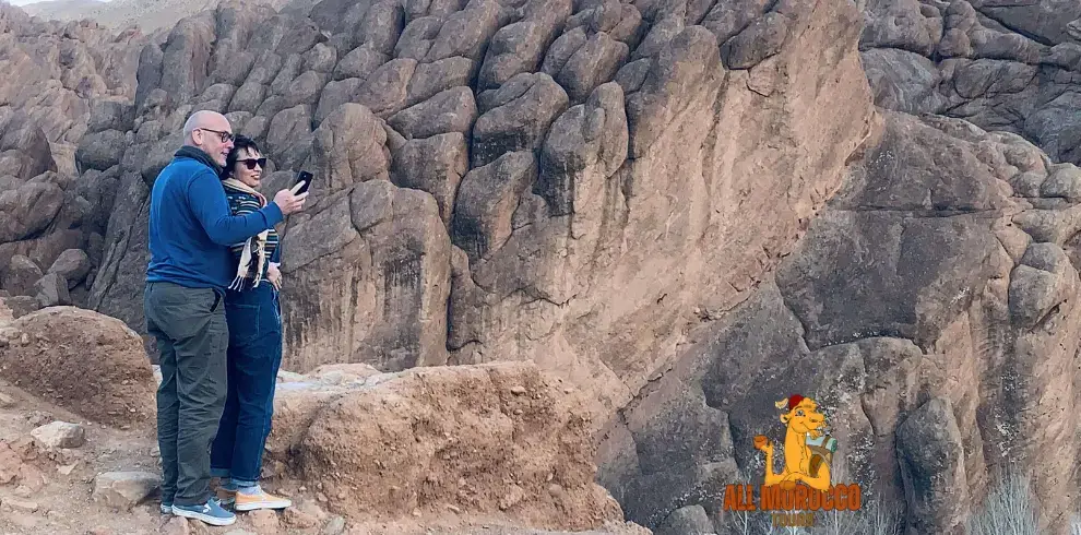 Travelers viewing the Monkey Fingers rock formations in Dades Valley during the 5 days Fes to Marrakech desert tour